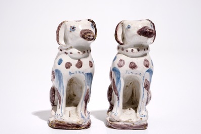 A pair of blue and manganese Brussels faience models of dogs, 18th C.