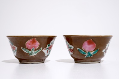 A pair of Chinese famille rose capucin ground cups and saucers, Qianlong