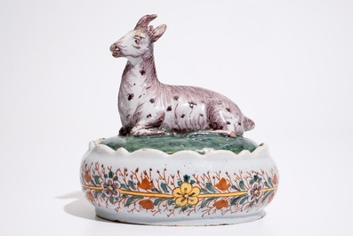 A polychrome Dutch Delft butter tub with a goat, 18th C.