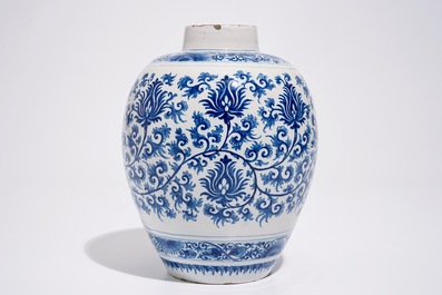 A Dutch Delft blue and white jar with peony scrolls in Ming-style, late 17th C.