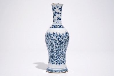 A Dutch Delft blue and white vase with peony scrolls in Ming-style, late 17th C.