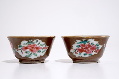 A pair of Chinese famille rose capucin ground cups and saucers, Qianlong