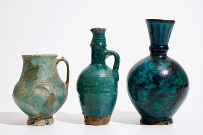 Three Islamic turquoise glazed jugs, incl. Raqqa and Iran, 14th C. and later