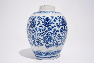 A Dutch Delft blue and white jar with peony scrolls in Ming-style, late 17th C.