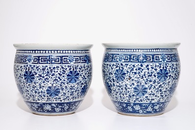 A pair of Chinese blue and white lotus scroll fishbowls, 19th C.