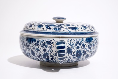 A Dutch Delft blue and white spiced wine bowl and cover with peacocks, early 18th C.