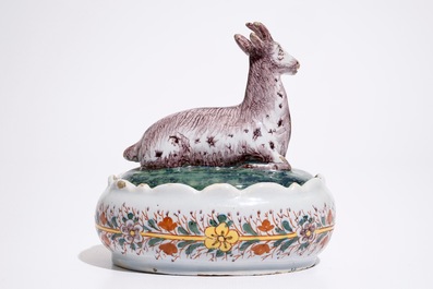 A polychrome Dutch Delft butter tub with a goat, 18th C.