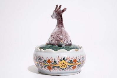 A polychrome Dutch Delft butter tub with a goat, 18th C.