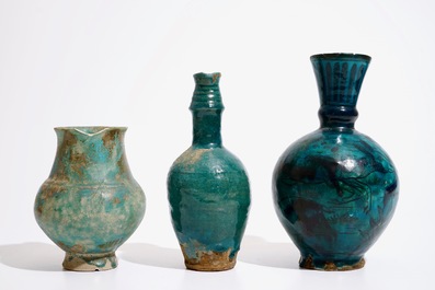Three Islamic turquoise glazed jugs, incl. Raqqa and Iran, 14th C. and later