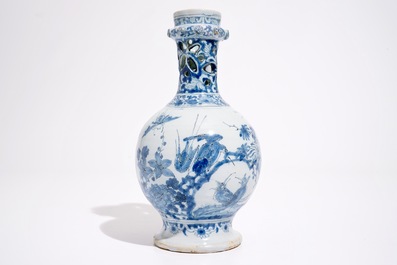 A rare Dutch Delft blue and white chinoiserie puzzle jug, late 17th C.
