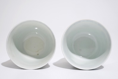 A pair of Chinese blue, white and gilt cups and saucers, Qianlong