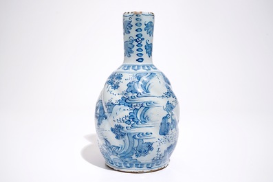 A gadrooned blue and white chinoiserie jug, Delft or Frankfurt, 17th C.