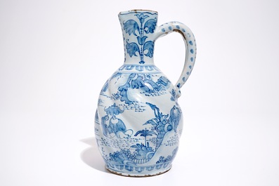 A gadrooned blue and white chinoiserie jug, Delft or Frankfurt, 17th C.