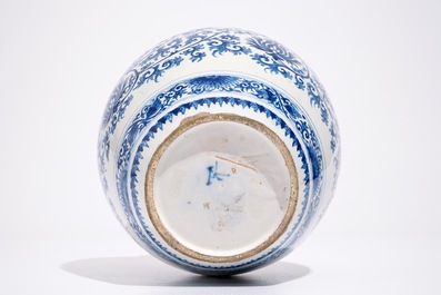 A Dutch Delft blue and white jar with peony scrolls in Ming-style, late 17th C.