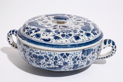 A Dutch Delft blue and white spiced wine bowl and cover with peacocks, early 18th C.