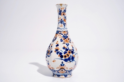 A Dutch Delft bottle vase with a floral chinoiserie design in red and blue, 1st quarter 18th C.