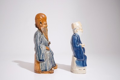 Two Chinese blue and white glazed biscuit figures of immortals, Qianlong