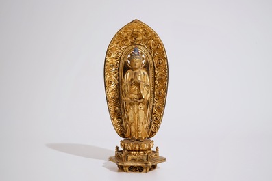 A Japanese lacquered and gilt wood &quot;Zushi&quot; shrine with a standing Buddha on a lotus throne, Edo, 17/18th C.
