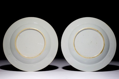 A pair of Chinese famille rose plates with figures on a terrace, Yongzheng