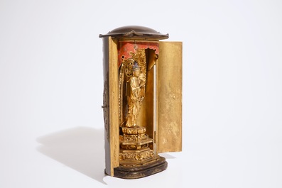 A Japanese lacquered and gilt wood &quot;Zushi&quot; shrine with a standing Buddha on a lotus throne, Edo, 17/18th C.