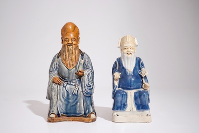 Two Chinese blue and white glazed biscuit figures of immortals, Qianlong