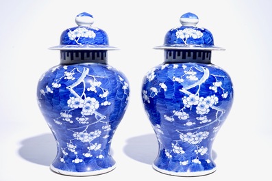 A pair of Chinese blue and white covered jars with &quot;prunus on breaking ice&quot; design, 19th C