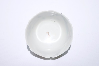 A fine Chinese export porcelain eggshell cup and saucer with a couple with a birdcage, Yongzheng