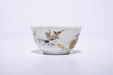 A fine Chinese export porcelain eggshell cup and saucer with a couple with a birdcage, Yongzheng