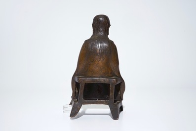 A Chinese bronze model of a seated Zhenwu, Ming