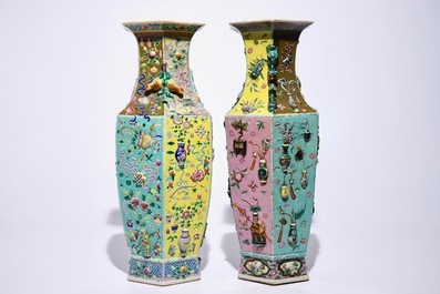 Two Chinese famille rose hexagonal relief-decorated vases, 19th C.