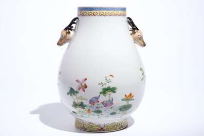 A Chinese famille rose hu vase with phoenixes and deer head handles, Qianlong mark, 19/20th C.
