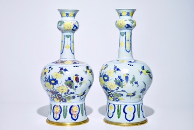 A pair of tall bronze-mounted polychrome Dutch Delft garlic-necked vases, late 17th C.