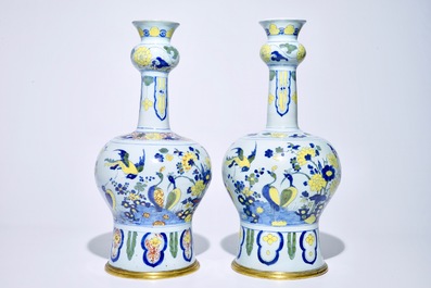 A pair of tall bronze-mounted polychrome Dutch Delft garlic-necked vases, late 17th C.