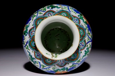 A Chinese wucai baluster vase with buddhist lions, 19th C.