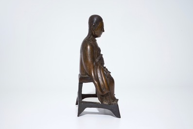 A Chinese bronze model of a seated Zhenwu, Ming