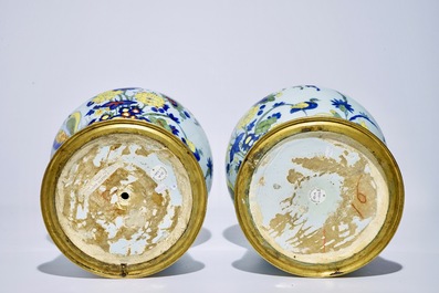 A pair of tall bronze-mounted polychrome Dutch Delft garlic-necked vases, late 17th C.