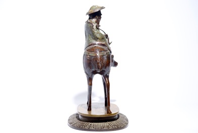 A large Chinese bronze and cloisonn&eacute; model of Shou Lao on a deer, on wooden base, 19/20th C.