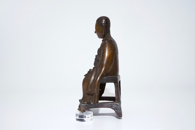 A Chinese bronze model of a seated Zhenwu, Ming
