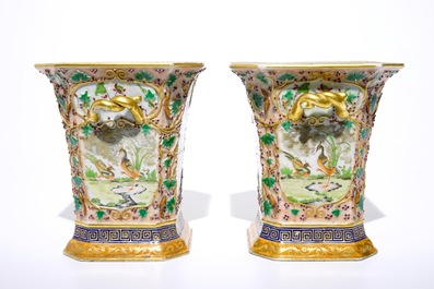 A pair of Chinese famille rose export bough pots with twisted handles and relief-decorated squirrels, Qianlong