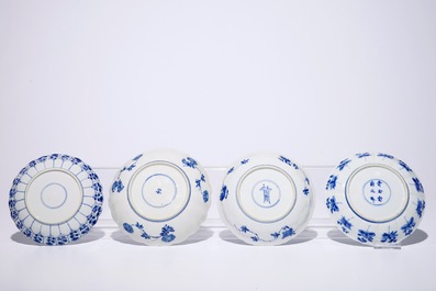 A Chinese blue and white silver-mounted jug and cover, a cup and saucer and three saucer plates, Kangxi