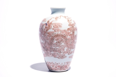 A Chinese vase with underglaze red with dragons among clouds, 19/20th C.