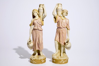 A pair of large Royal Dux Greek style figures carrying jugs, Bohemia, early 20th C.