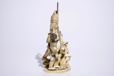 A Japanese ivory okimono of a hunter and his son, Meiji, late 19th C., signed