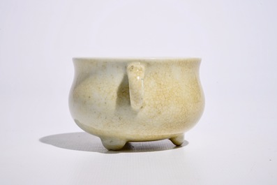 A Chinese crackle glazed blanc de Chine two-handled tripod incense burner, Kangxi