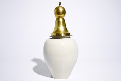 A Dutch Delft blue and white tobacco jar with brass cover, 18th C.