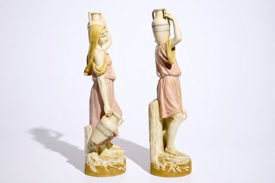 A pair of large Royal Dux Greek style figures carrying jugs, Bohemia, early 20th C.