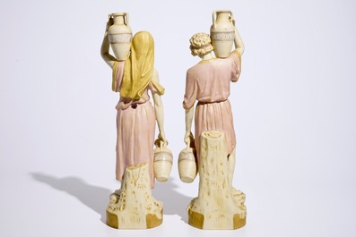 A pair of large Royal Dux Greek style figures carrying jugs, Bohemia, early 20th C.