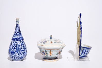 A Dutch Delft blue and white holy water font and a vase, with a polychrome covered spice box, 18th C.