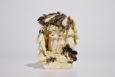 A Chinese ivory group with musicians surrounding a phoenix, early 20th C.