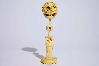 A Chinese carved ivory puzzle ball on stand, Canton, 19th C.